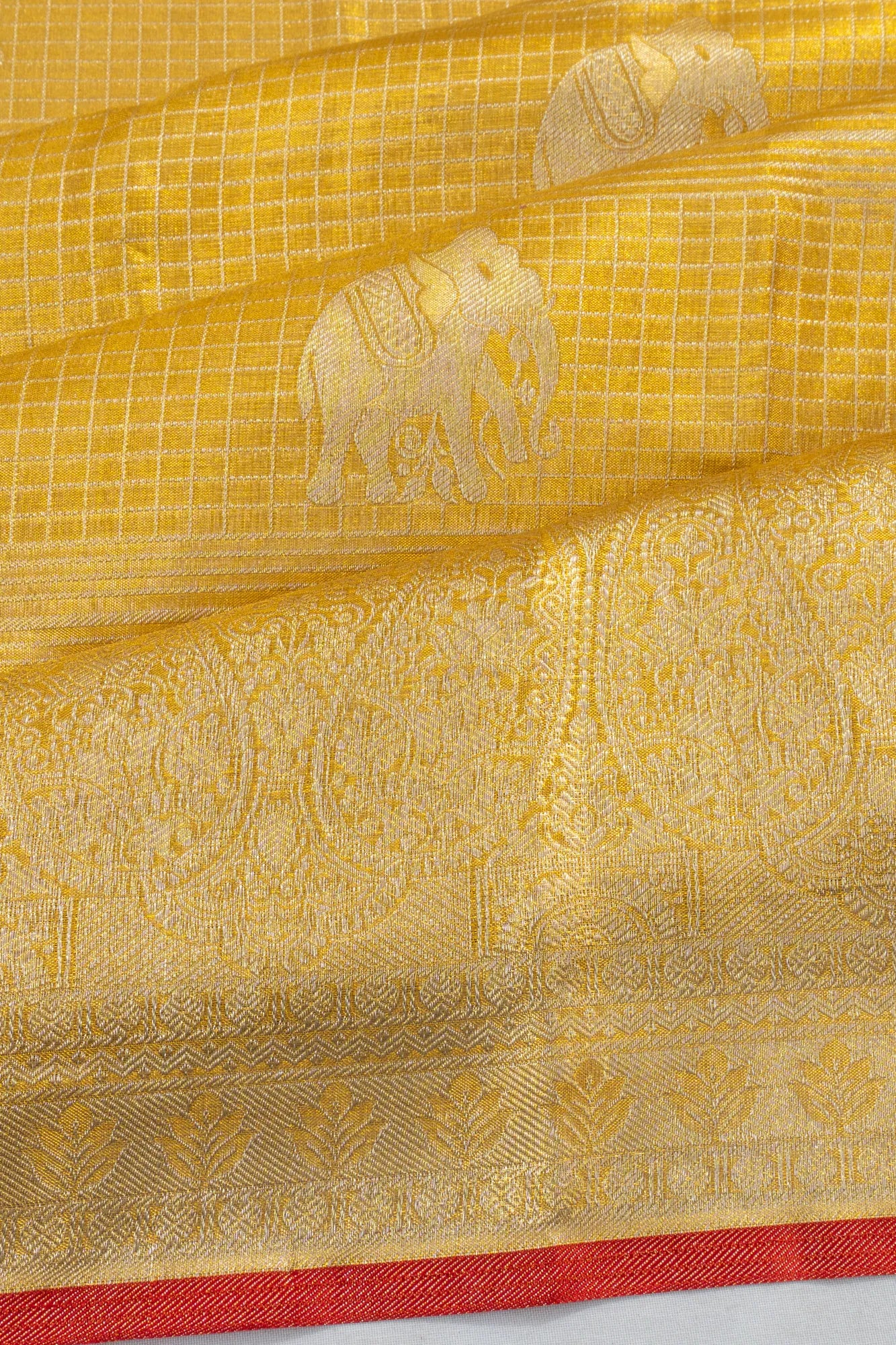 Taranga Kanchi Silk Tissue Checks And Butta Gold Saree