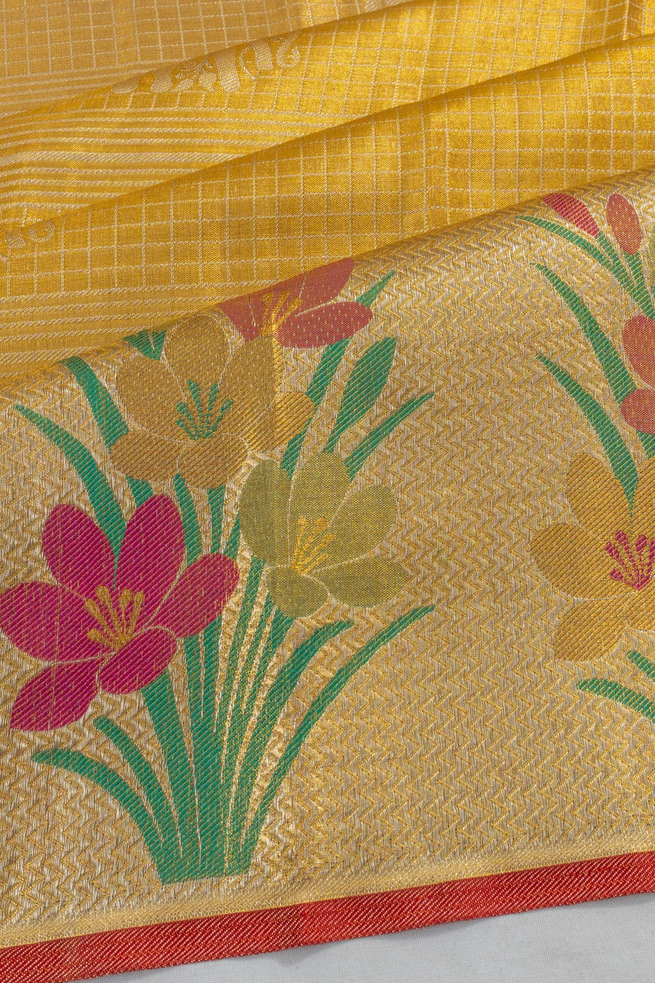 Taranga Kanchi Silk Tissue Checks And Butta Gold Saree