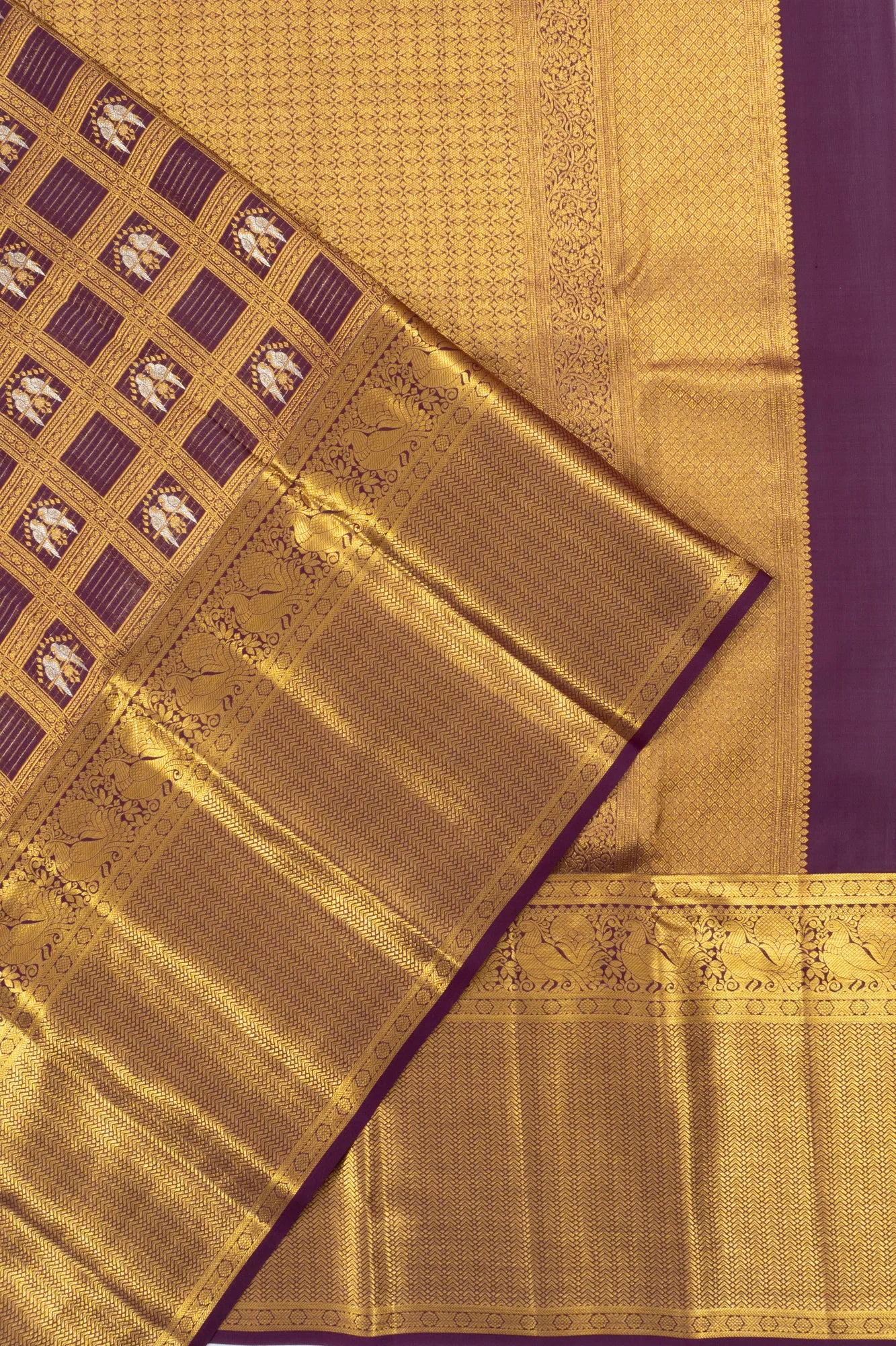 Taranga Kanchi Silk Checks And Butta Purple Saree