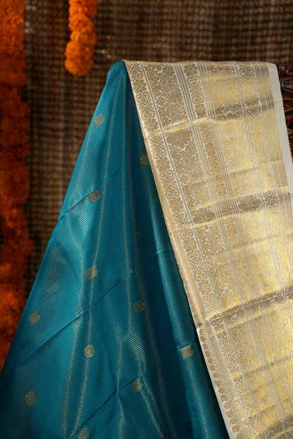 Kanchipuram Silk Oosi Lines And Butta Teal Blue Saree