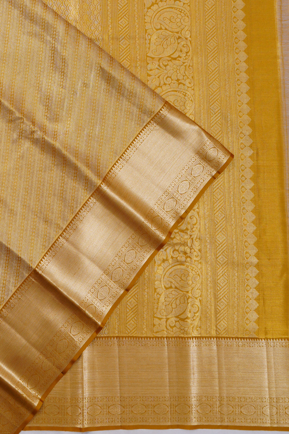 Taranga Kanchi Silk Tissue Brocade Gold Saree
