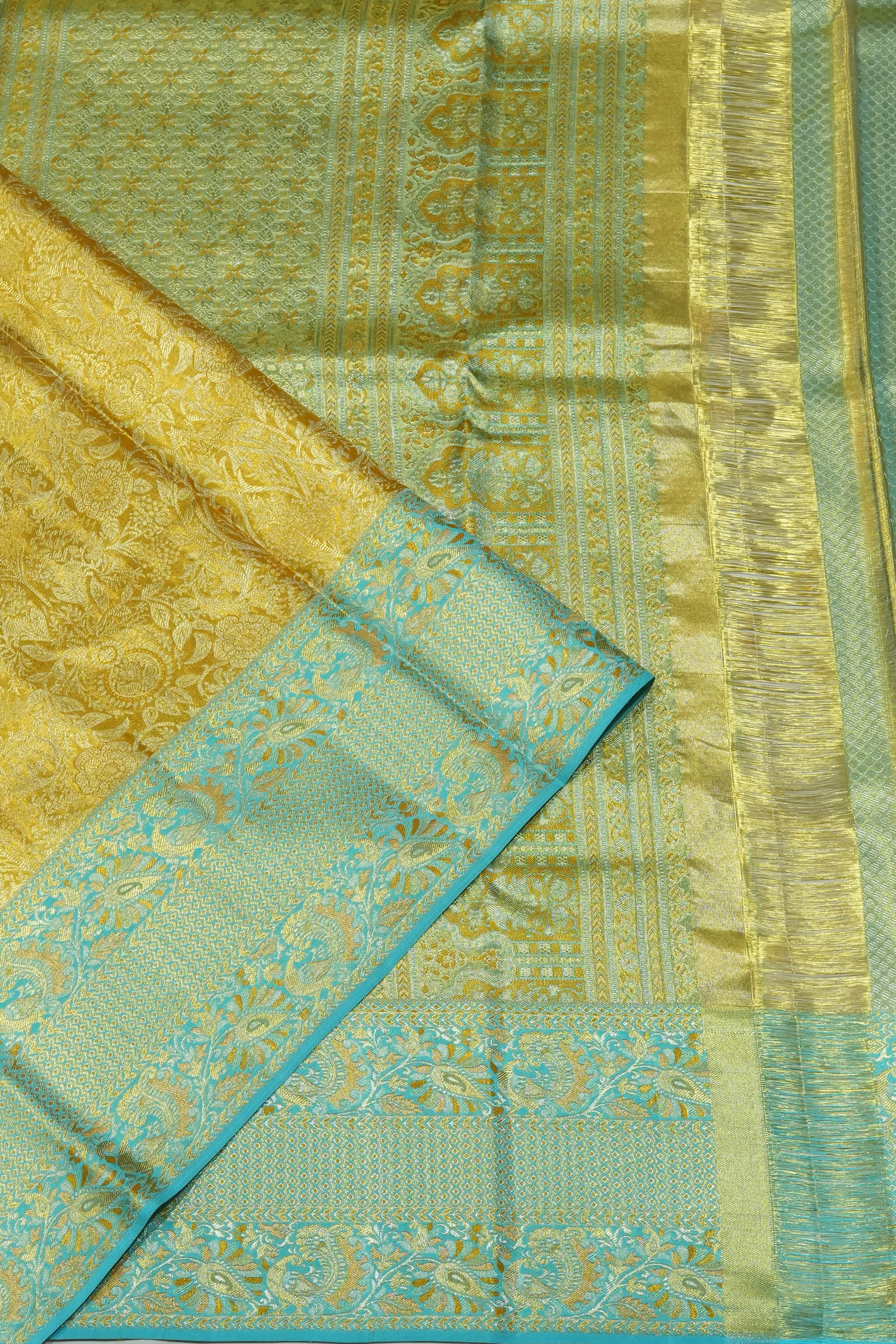 Taranga Kanchi Silk Tissue Brocade Gold Saree