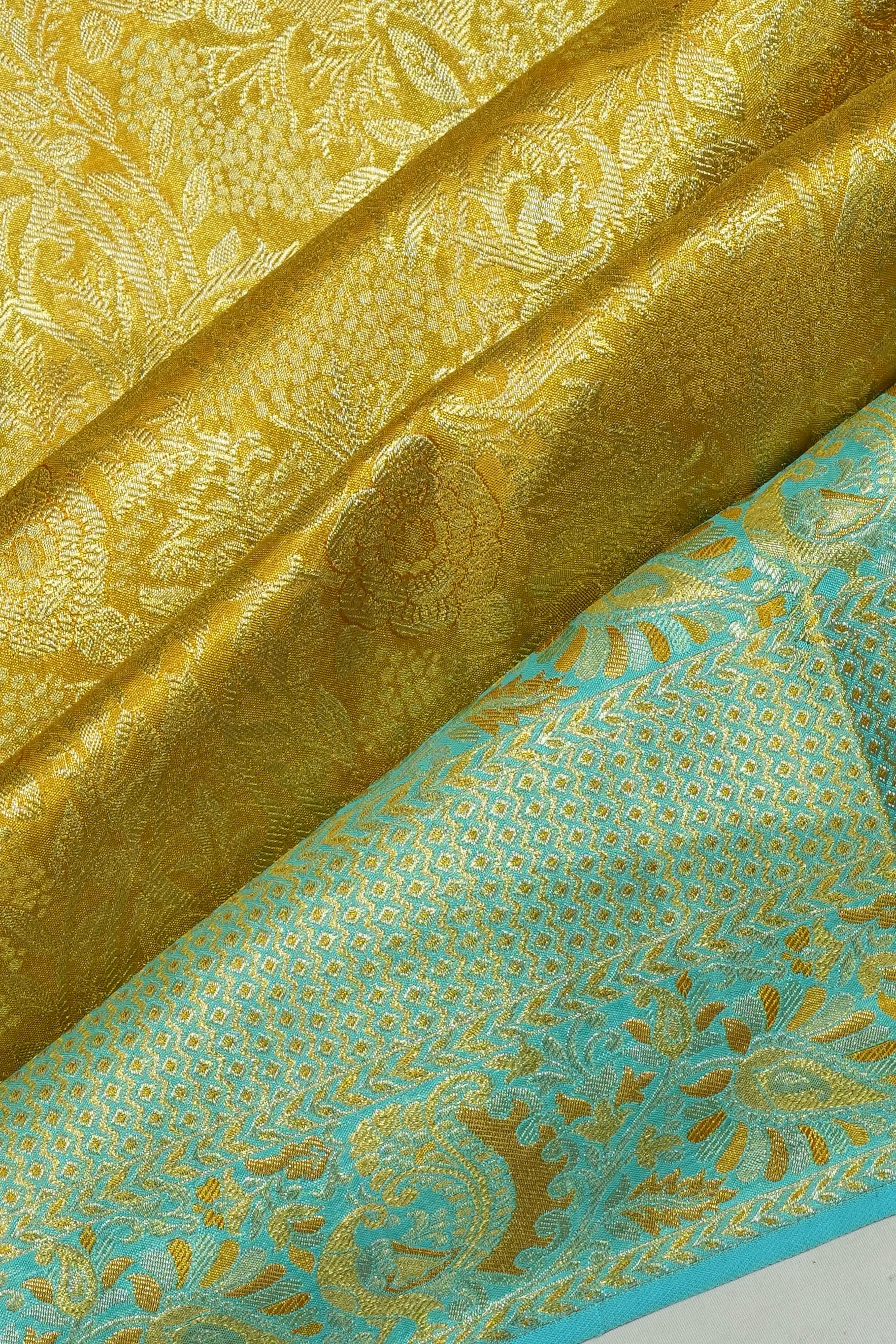Taranga Kanchi Silk Tissue Brocade Gold Saree