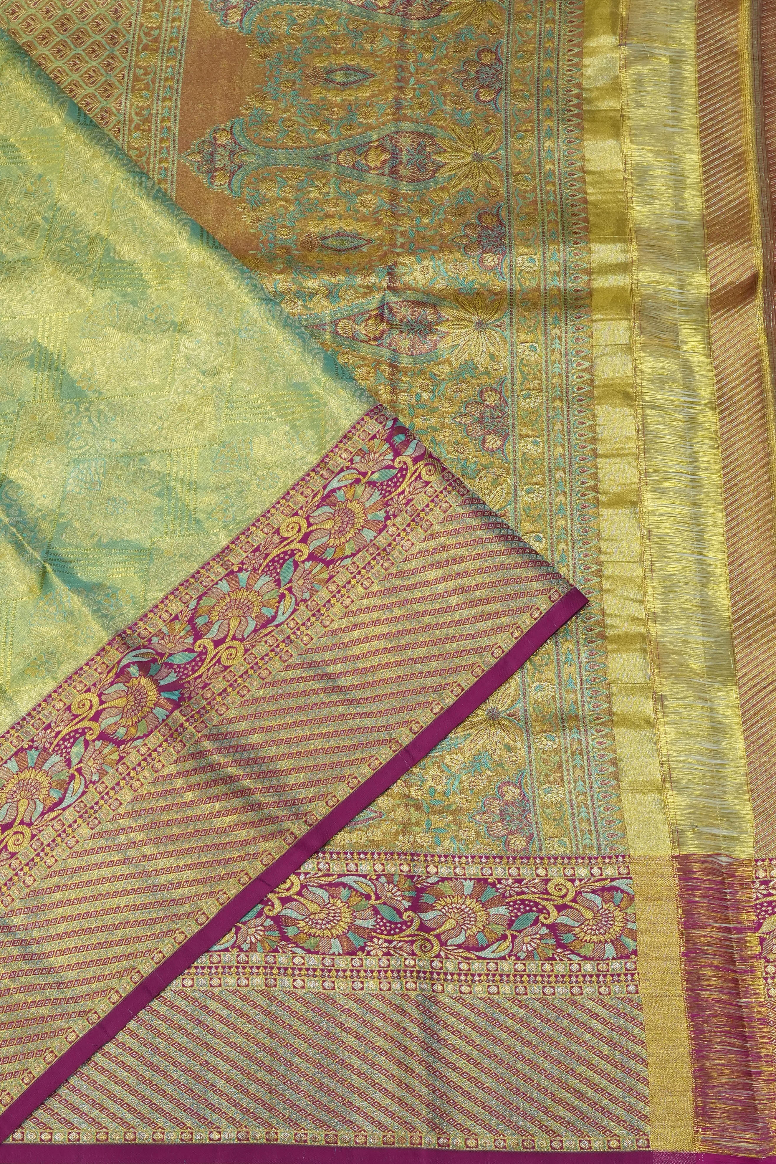 Taranga Kanchi Silk Tissue Brocade Green Saree