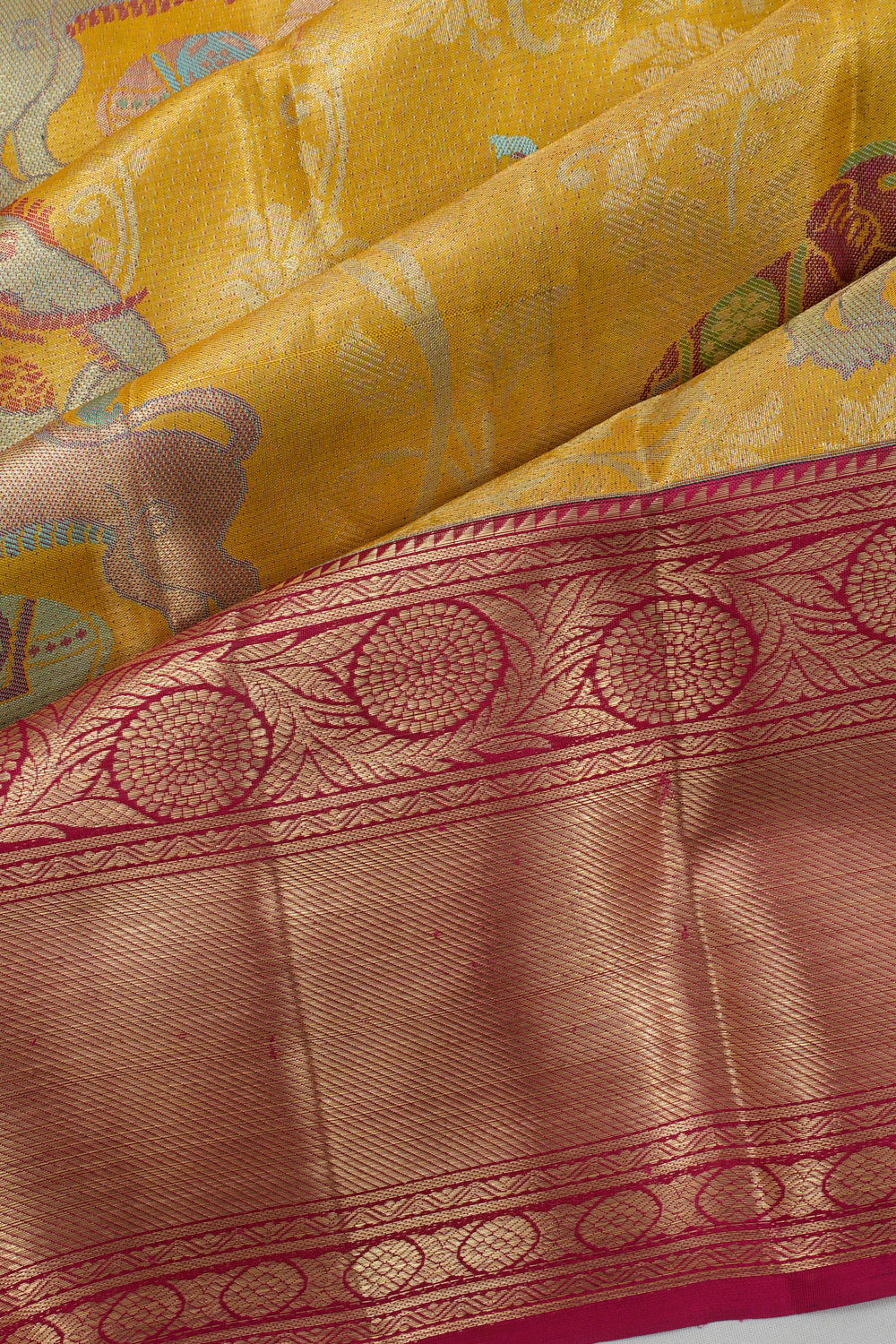 Taranga Kanchi Silk Jaal And Butta Gold Saree