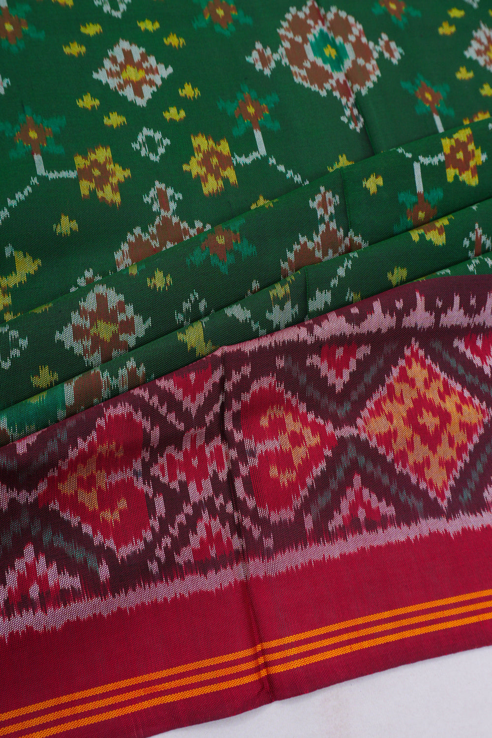 Semi Patan Silk Ikat Bottle Green Saree