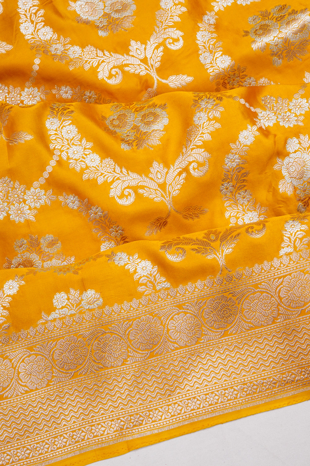 Vaanya Banaras Silk Jaal And Butta Yellow Saree