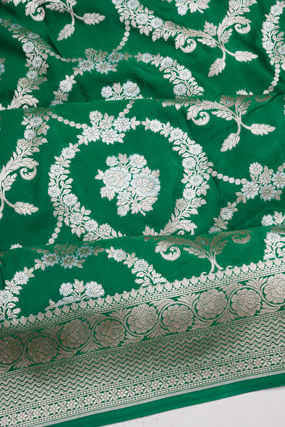 Vaanya Banaras Silk Jaal And Butta Green Saree