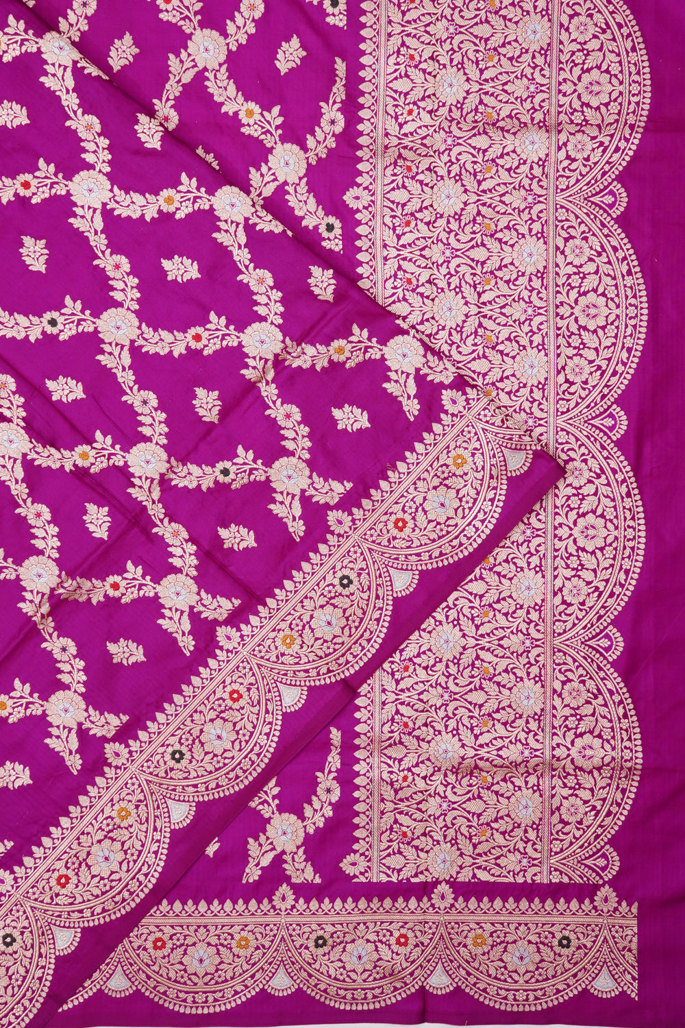 Vaanya Banaras Silk Jaal And Butta Magenta Saree