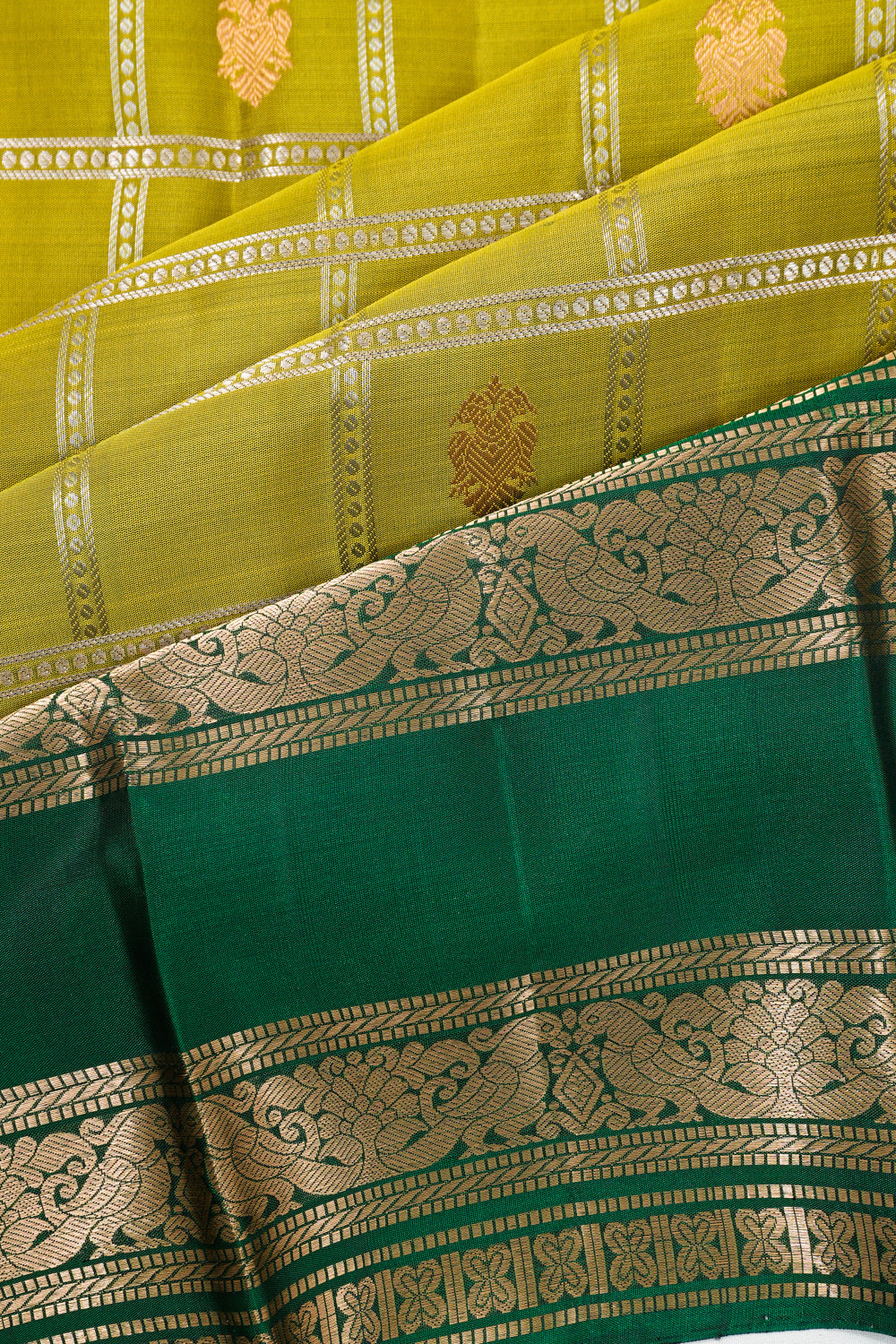 Taranga Kanchi Silk Checks And Butta Mehandi Green Saree With Rettai Pettu Border