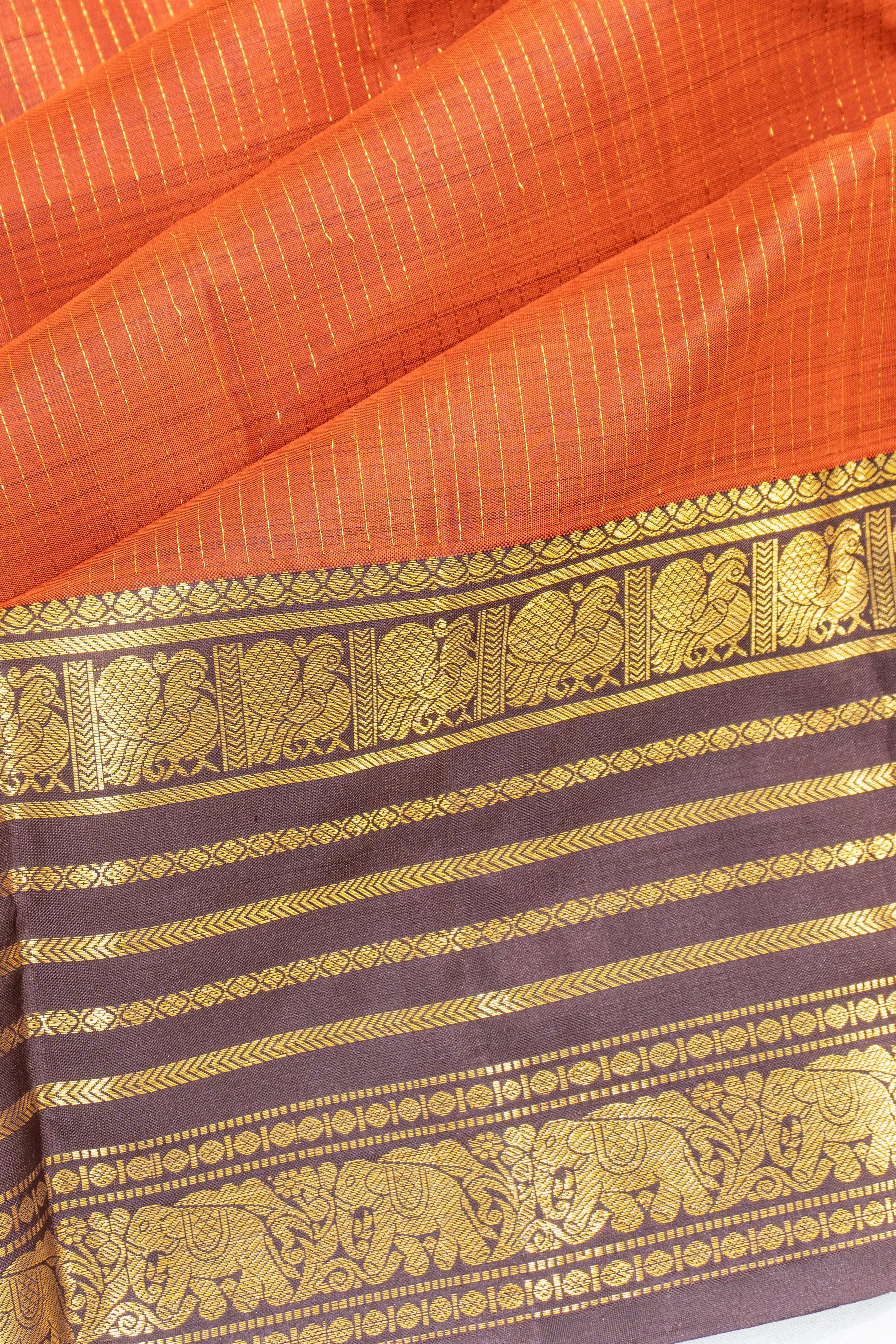 Kanchipuram Silk Oosi Lines And Butta Rust Orange Saree