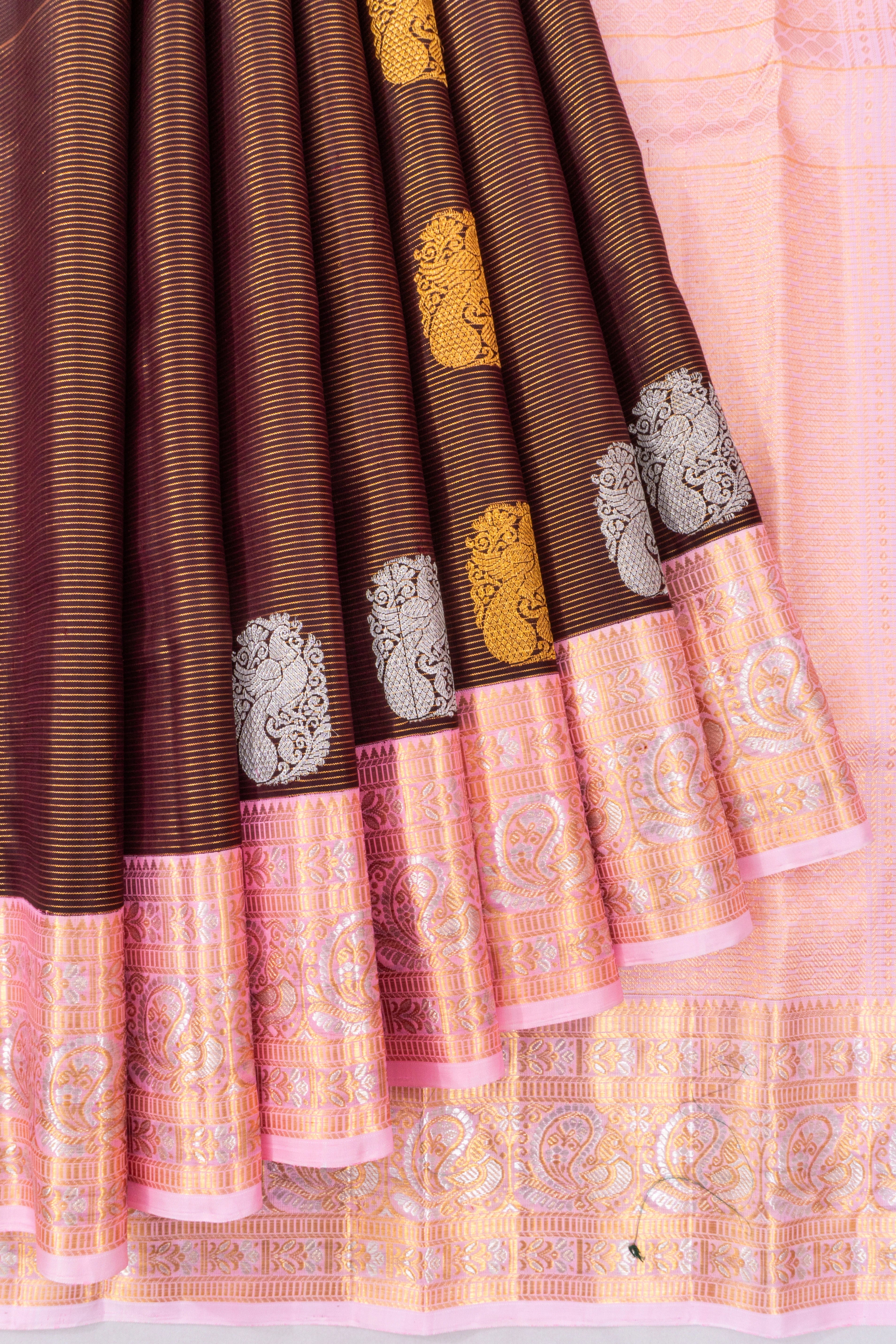 Kanchipuram Silk Oosi Lines And Butta Maroon Saree