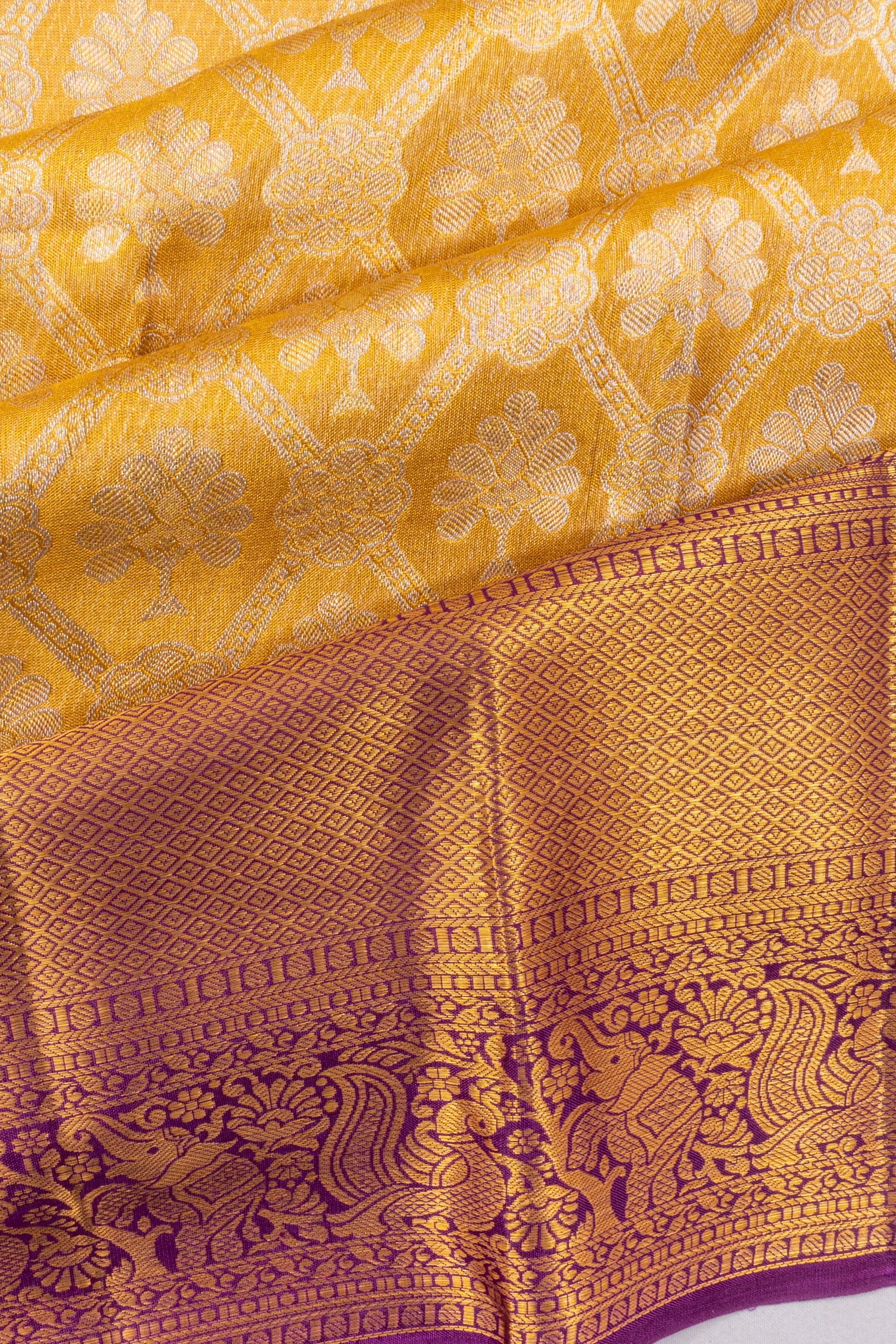 Taranga Kanchi Silk Tissue Brocade And Butta Gold Saree
