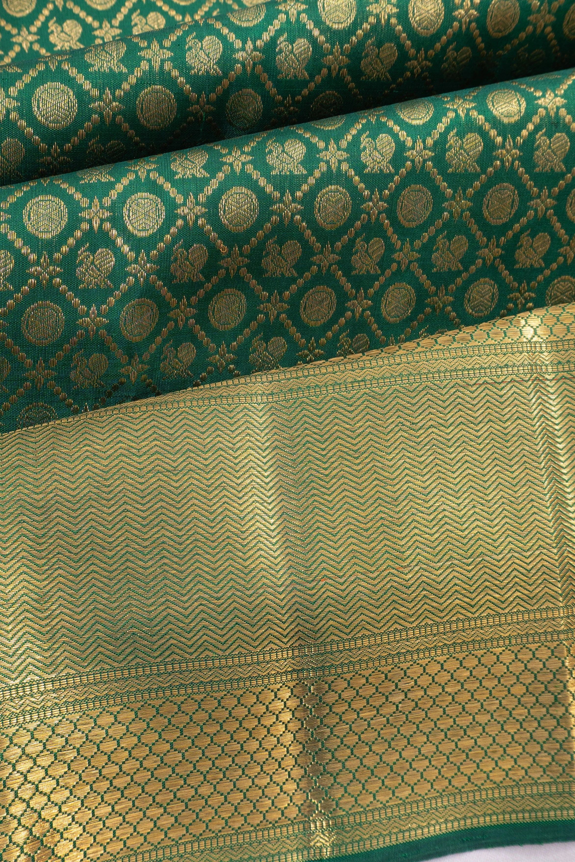 Kanchipuram Silk Brocade And Butta Bottle Green Saree