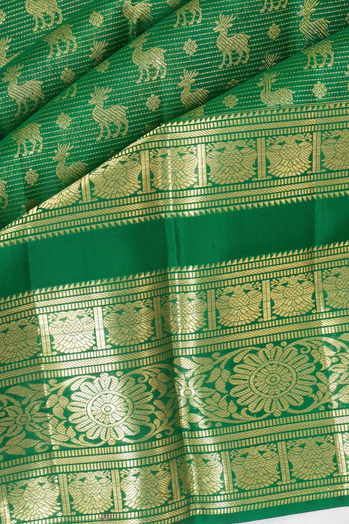 Taranga Kanchi Silk Lines And Butta Green Saree With Rettai Pettu Border