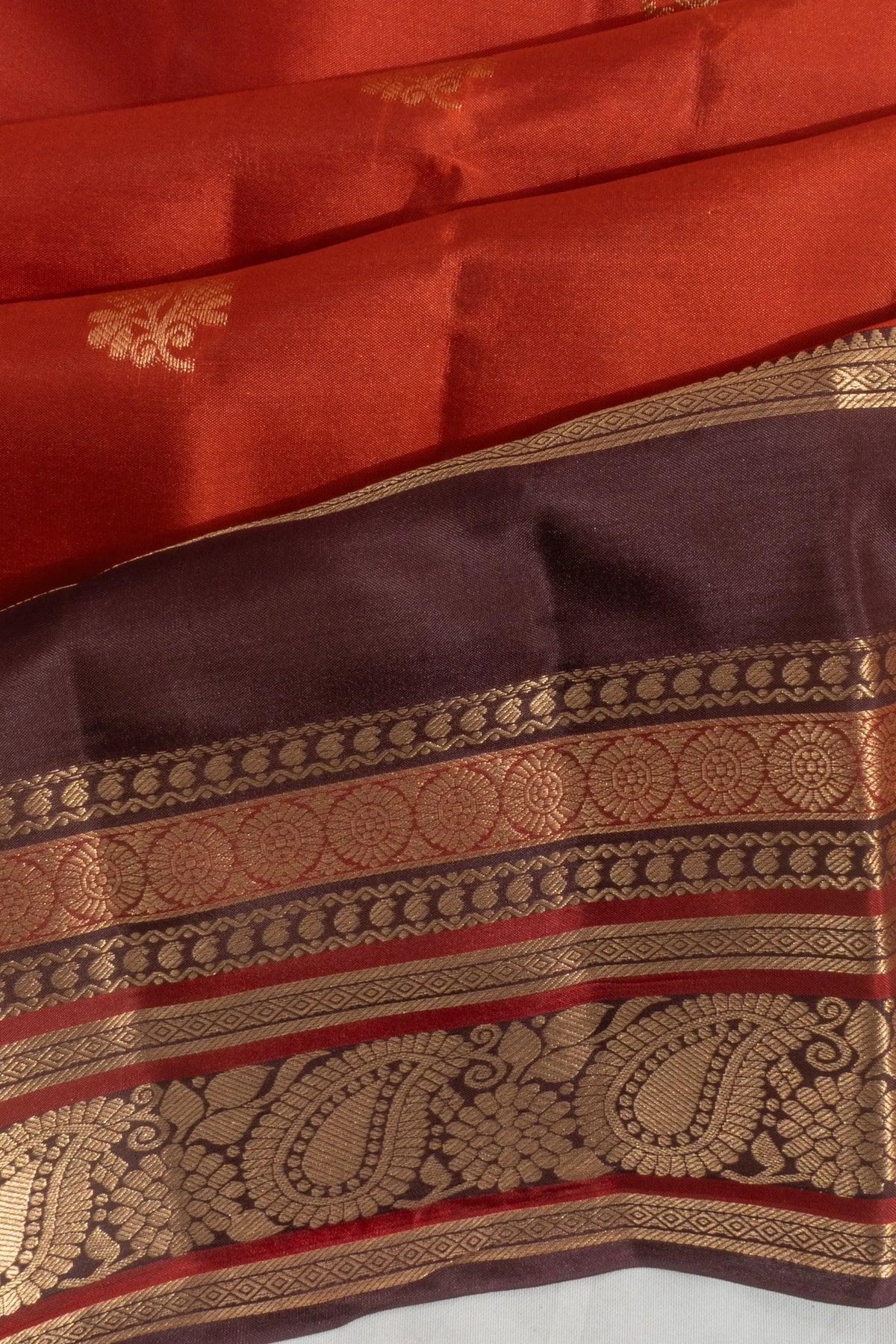 Taranga Kanchi Silk Butta Rust Orange Saree