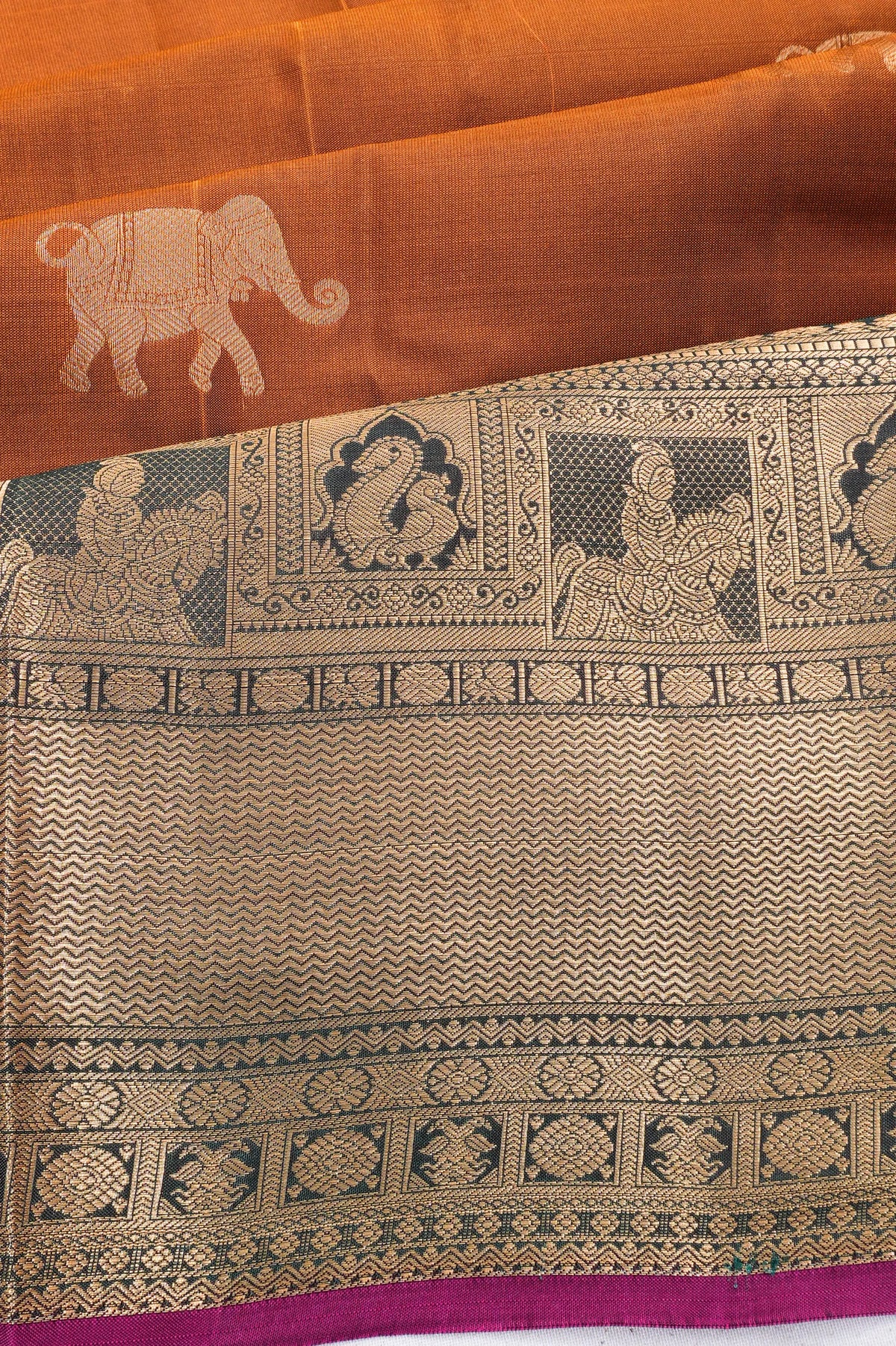 Taranga Kanchi Silk Butta Rust Orange Saree