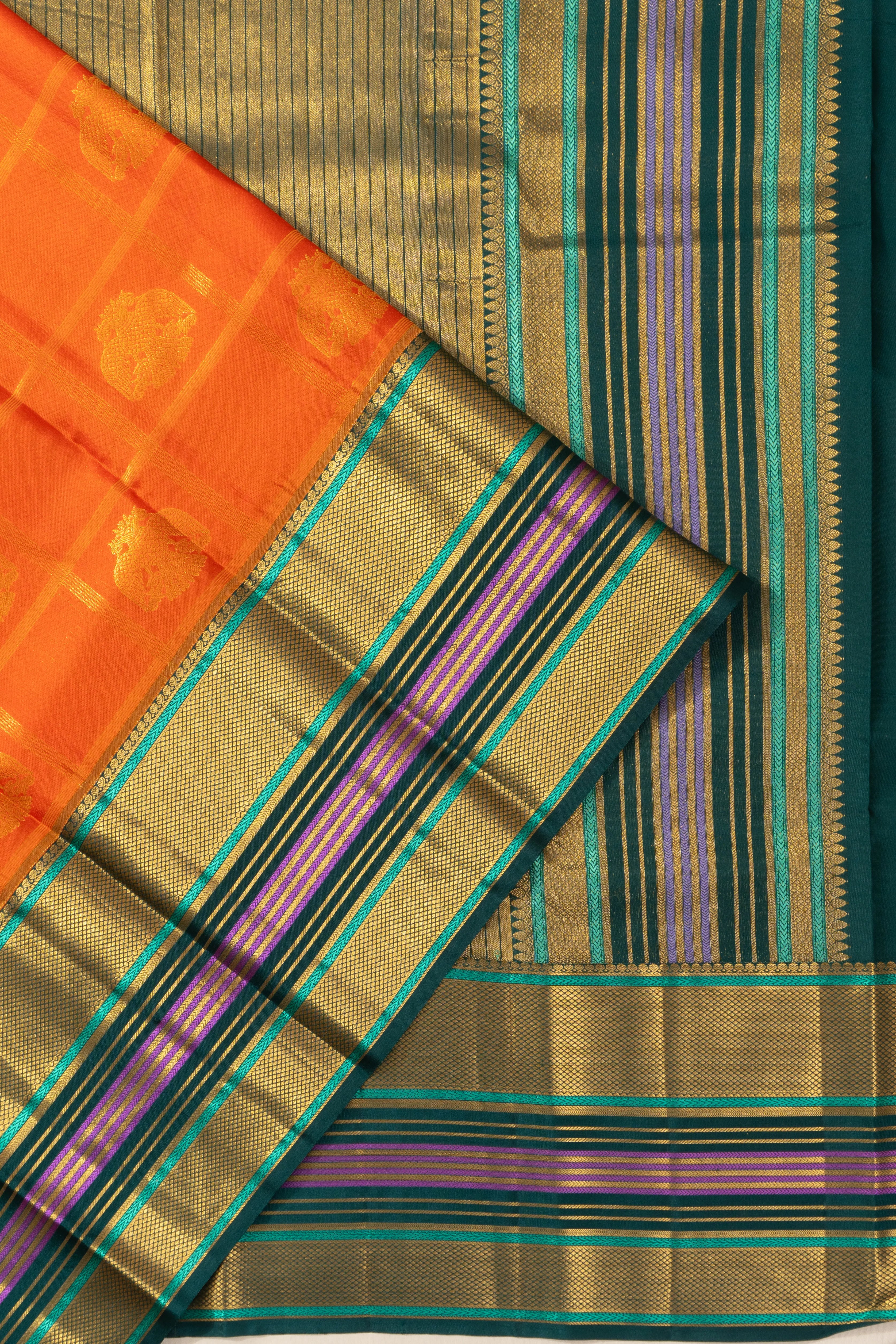 Taranga Kanchi Silk Checks And Butta Orange Saree