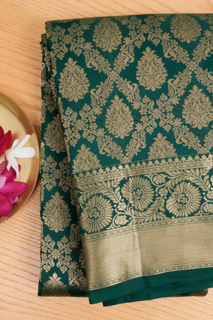 Taranga Kanchi Silk Jaal And Butta Green Saree