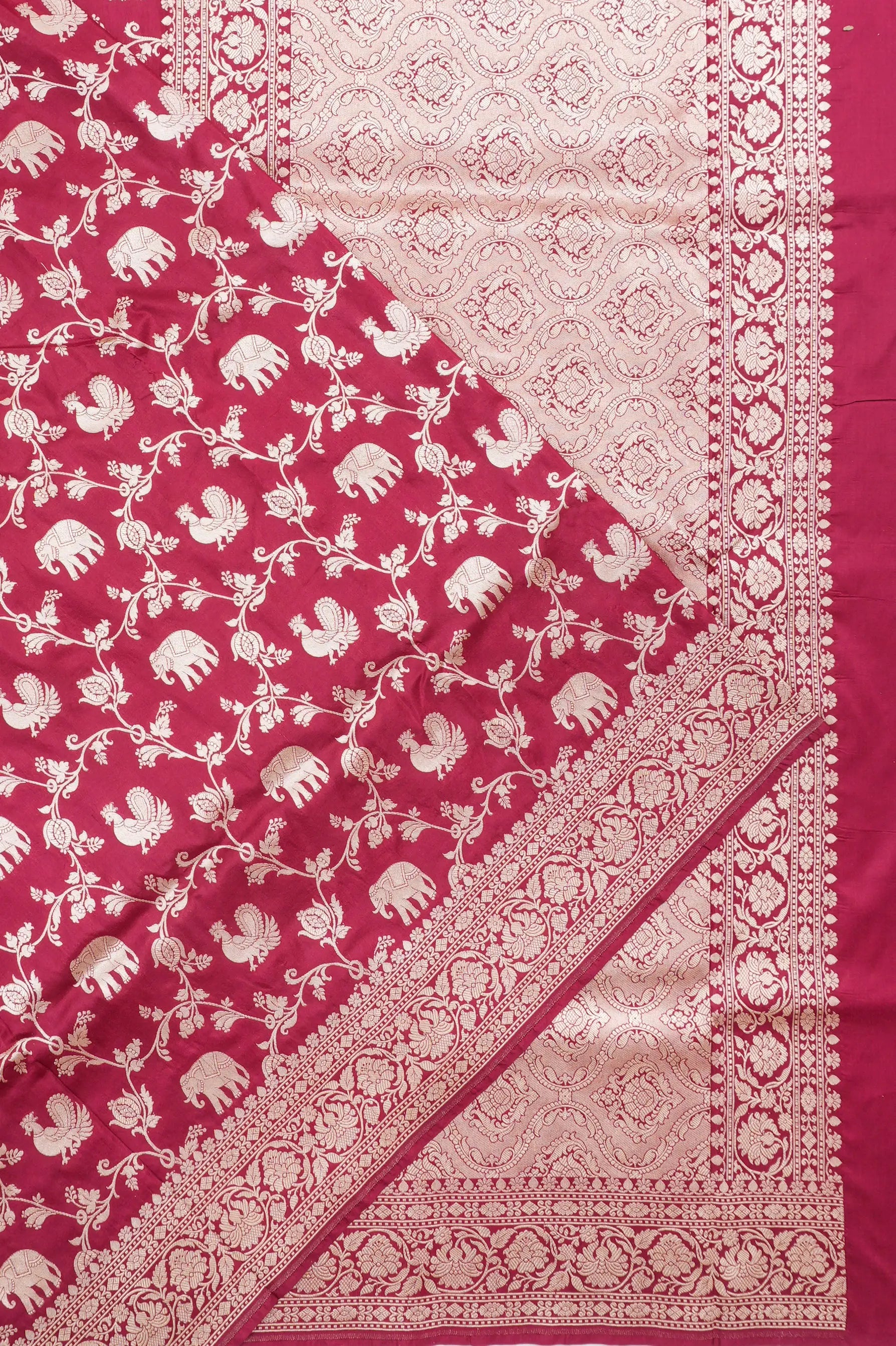 Vaanya Banaras Silk Jaal And Butta Maroon Saree