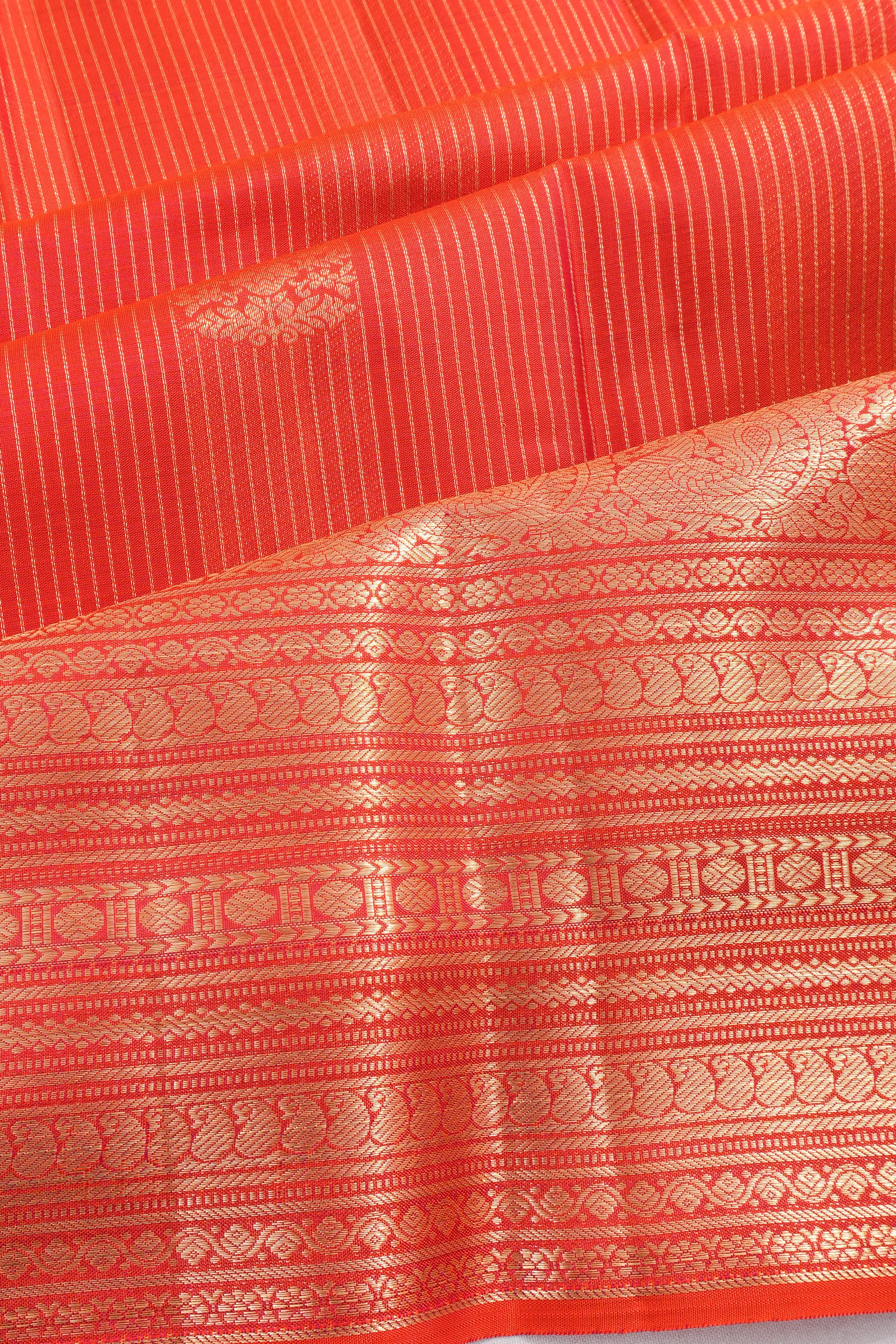 Taranga Kanchi Silk Lines And Butta Orange Saree