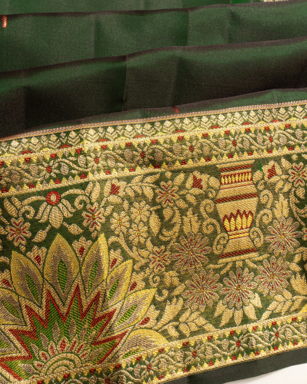 Taranga Kanchi Silk Butta Bottle Green Saree
