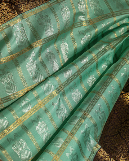 Kanchipuram Silk Checks And Butta Green Saree