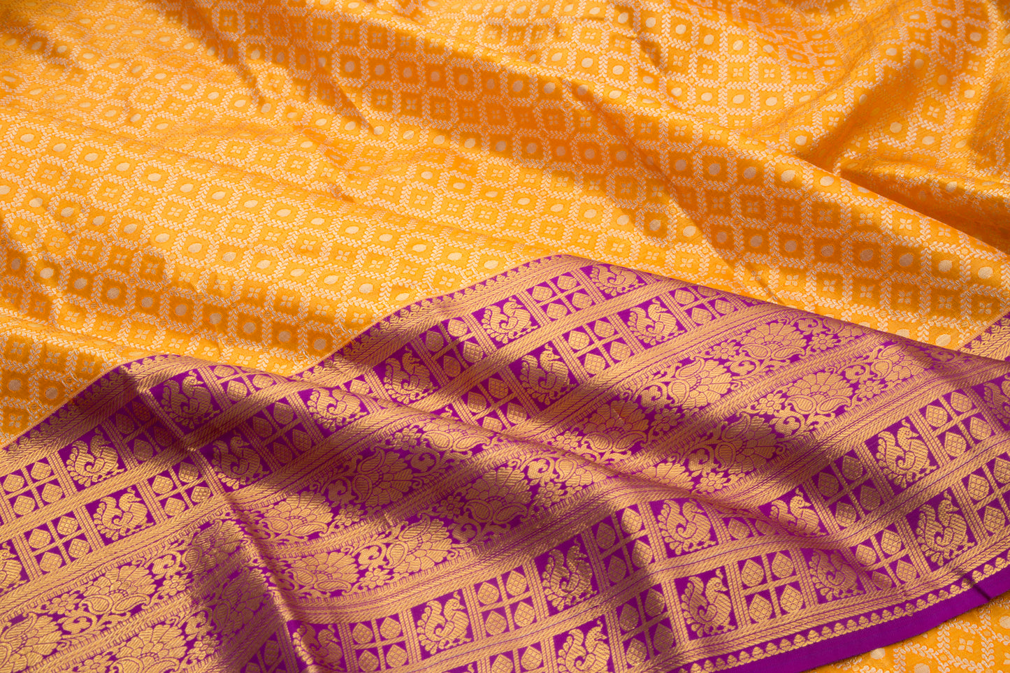 Kanchipuram Silk Tissue Criss-Cross Checks And Butta Orange Saree