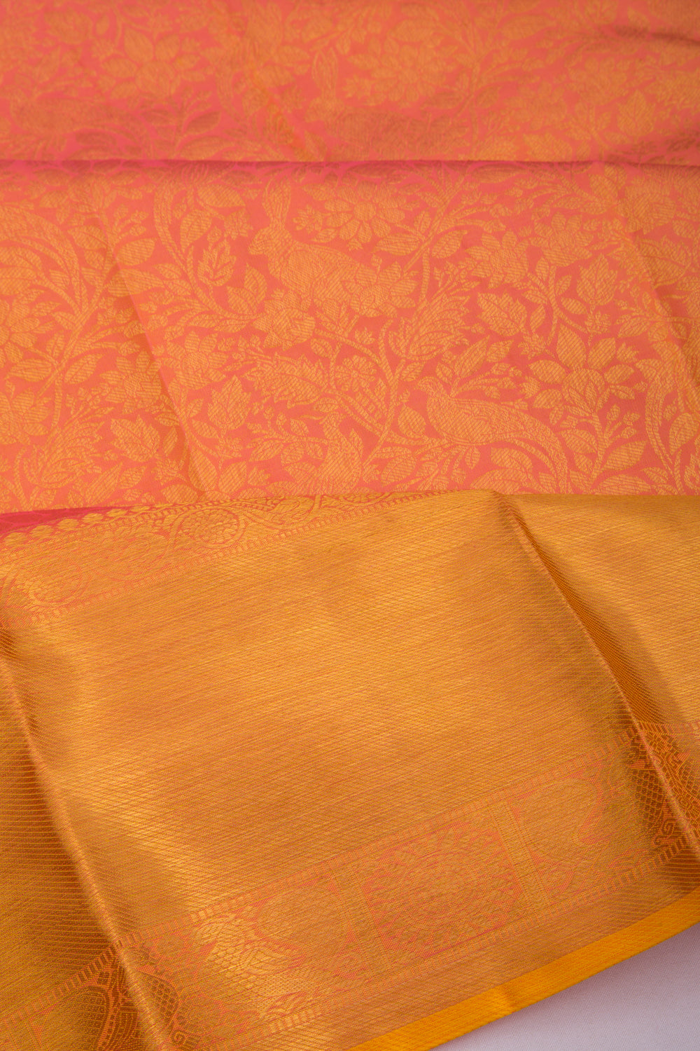 Taranga Kanchi Silk Jaal Pinkish Orange Saree