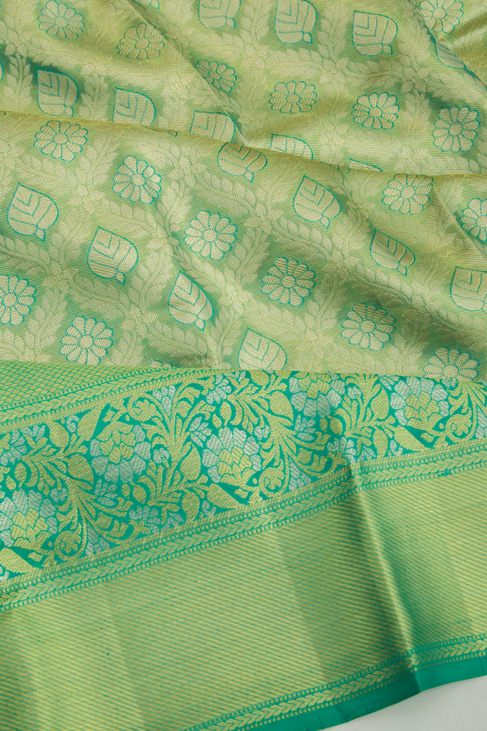 Taranga Kanchi Silk Tissue Brocade Green Saree