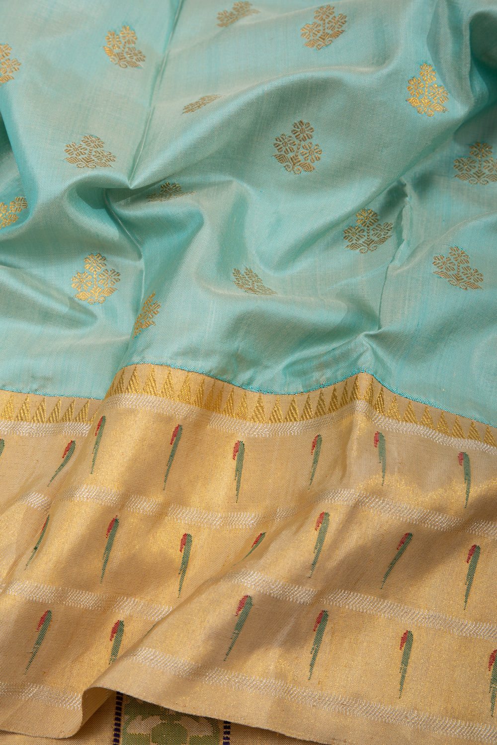 Kanchipuram Silk Butta Pastel Blue Saree With Triple Muniya Border And Ikat Blouse