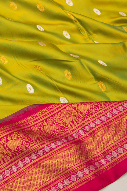 Kanchipuram Silk Twill And Butta Green Saree With Ikat Blouse