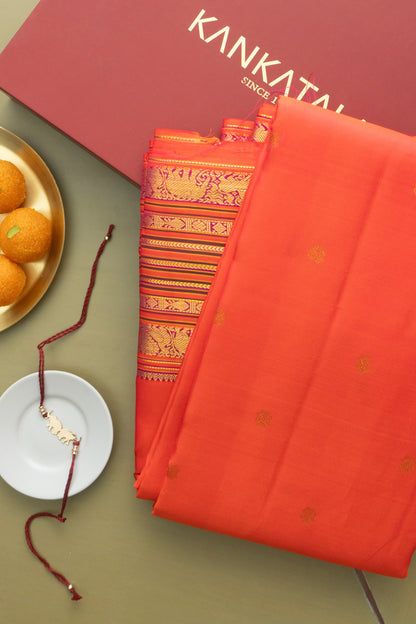 Classic Kanchipuram Silk Butta Orange Saree With Rakhi