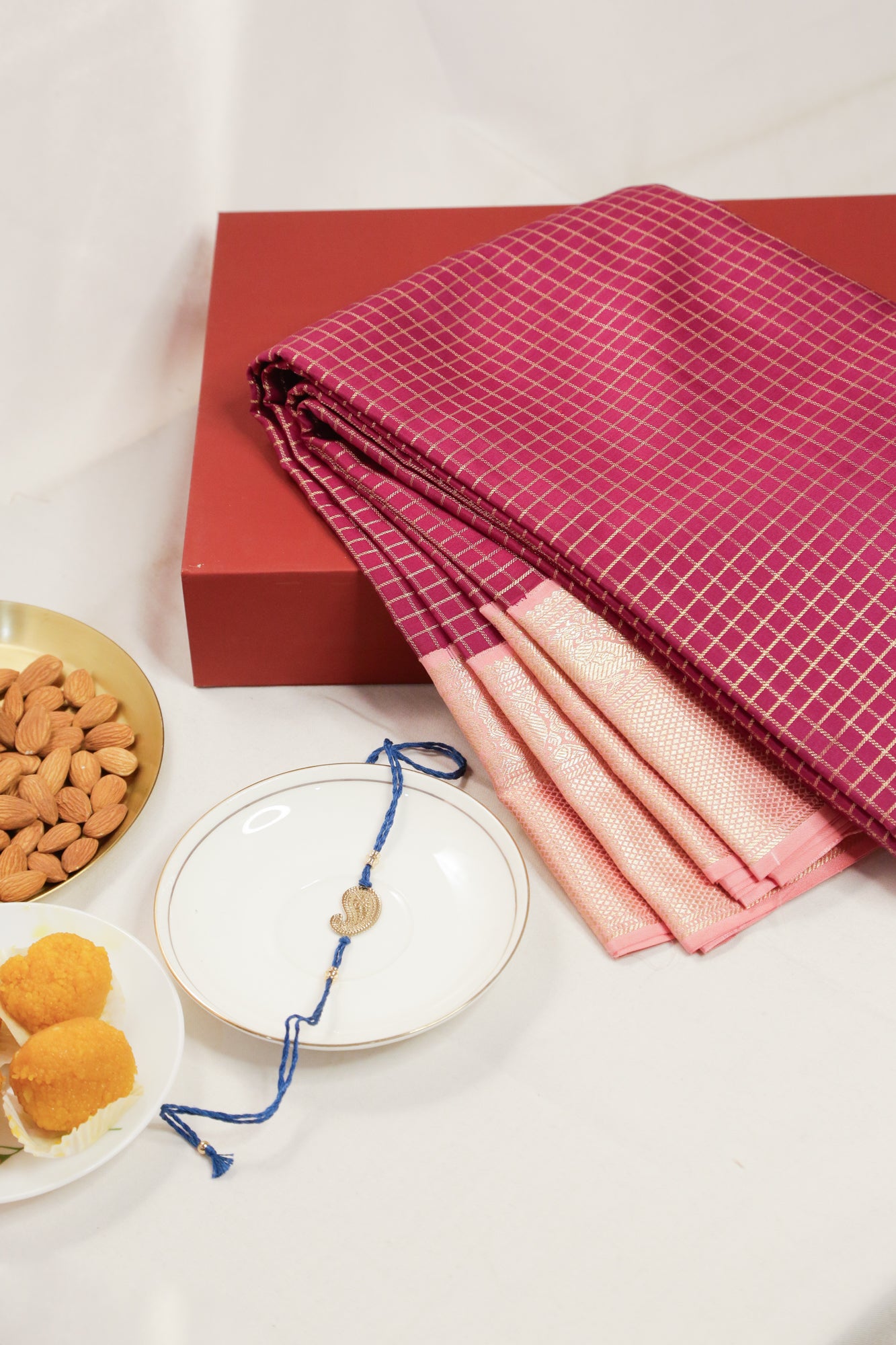 Taranga Kanchi Silk Checks Purple Saree With Gift Box And Rakhi