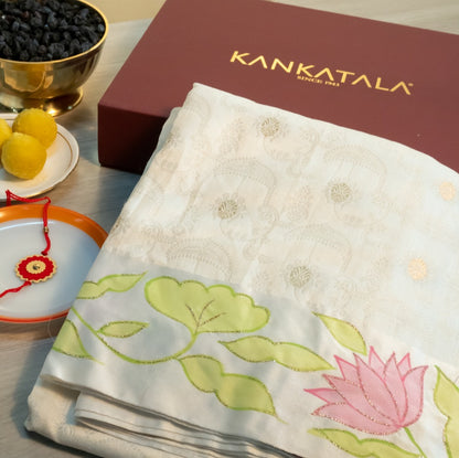 Soft Tussar Jacquard And Butta Cream Saree With Floral Printed Satin Border With Gift Box And Rakhi