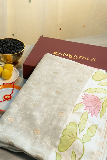 Soft Tussar Jacquard And Butta Cream Saree With Floral Printed Satin Border With Gift Box And Rakhi